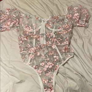 Shear body suit size large have never been worn